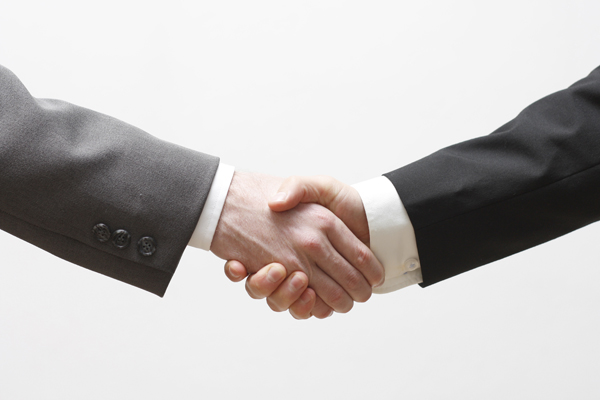 Two business men shaking hands