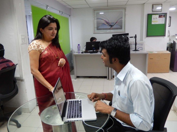 Shilpi Kapoor, founder and managing director of BarrierBreak, aids a visually impaired computer user.