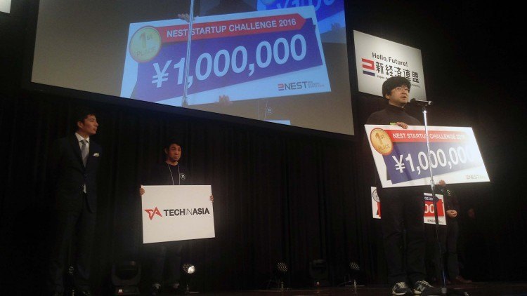 Founder and CEO Yasuyuki Hamada of AgriBus-Navi accepts the first place prize at NEST 2016.